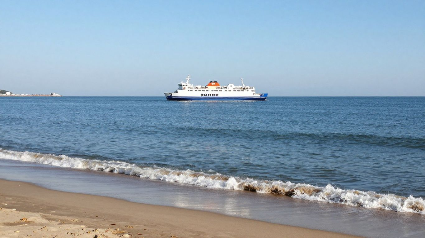 DFDS ferry sailing on calm blue sea.
